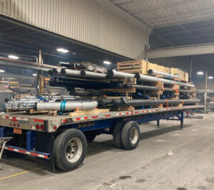 Trailer of pipe leaving manufacturing facility